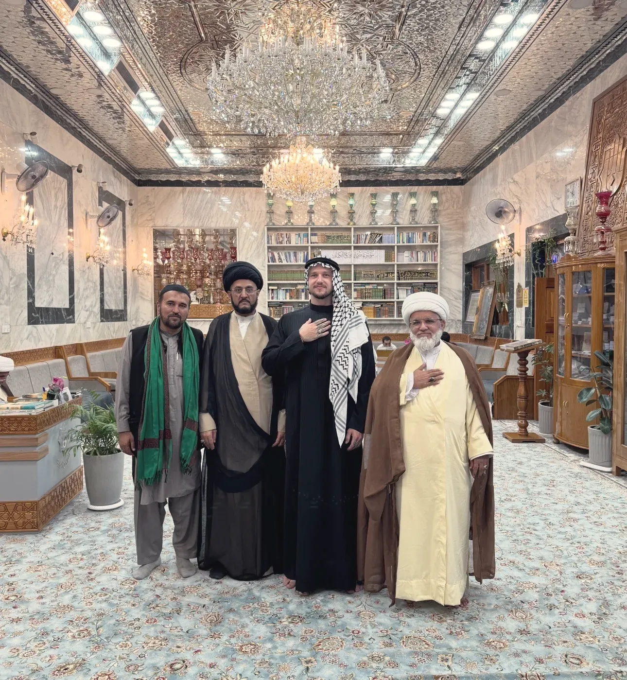 Dovydas Liaudanskas with religious leaders inside a shrine in Kerbala, Iraq, in 2025
